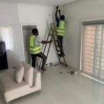 Two solar engineers working on a ceiling